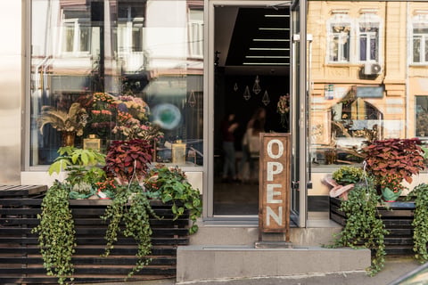 Open signboard and flower shop storefront